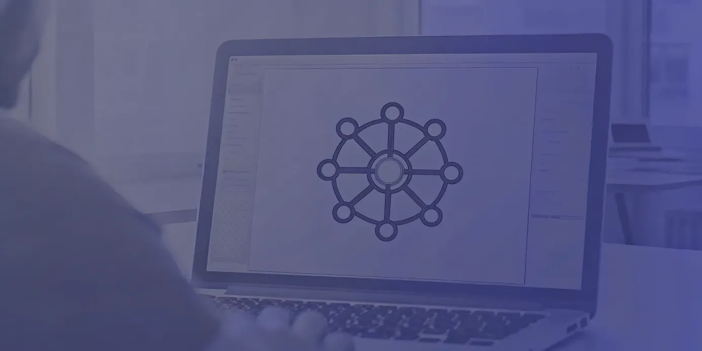 Kubernetes Ingress network diagram on a laptop screen.