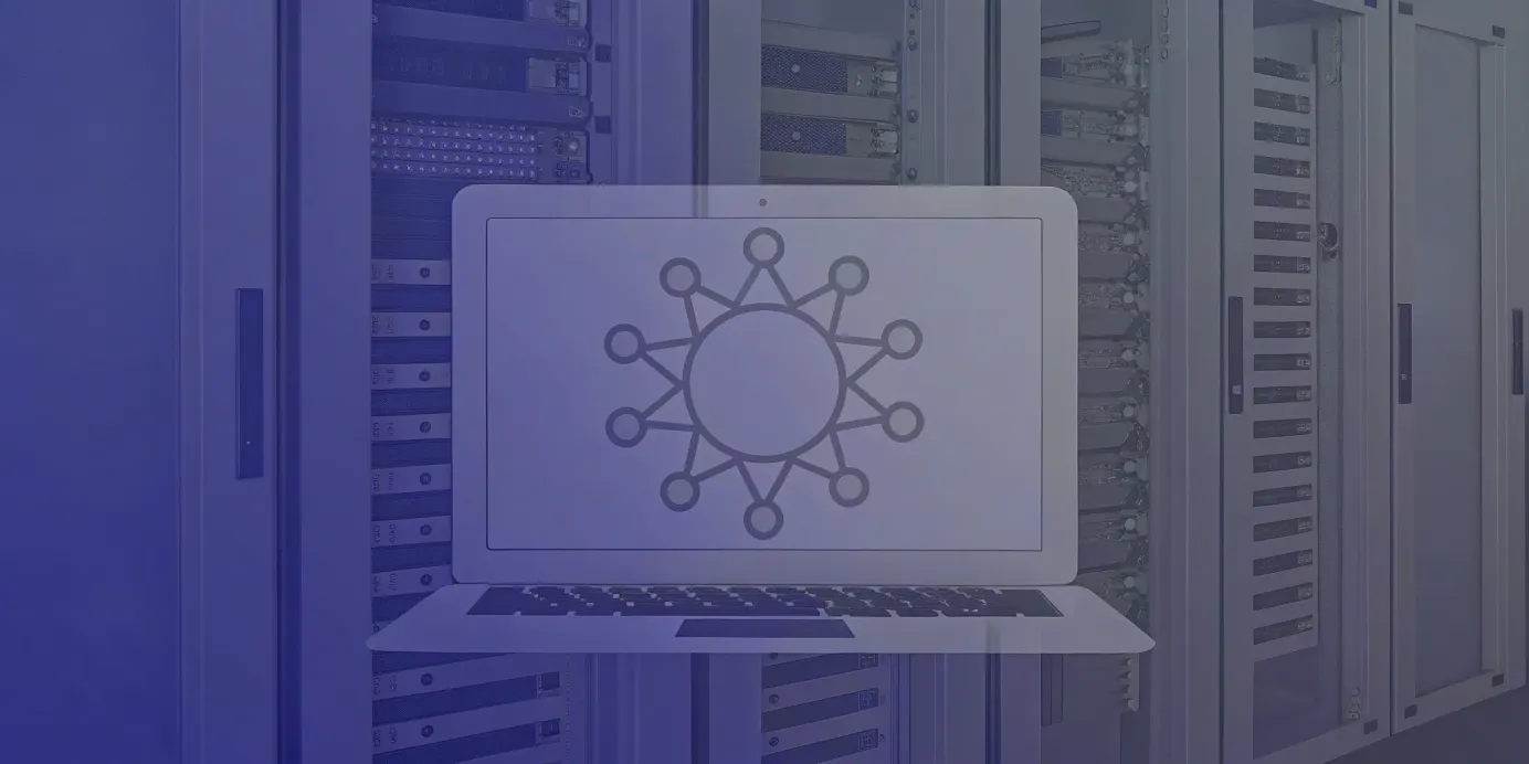 Kubernetes.io logo displayed on a laptop with server racks in the background.