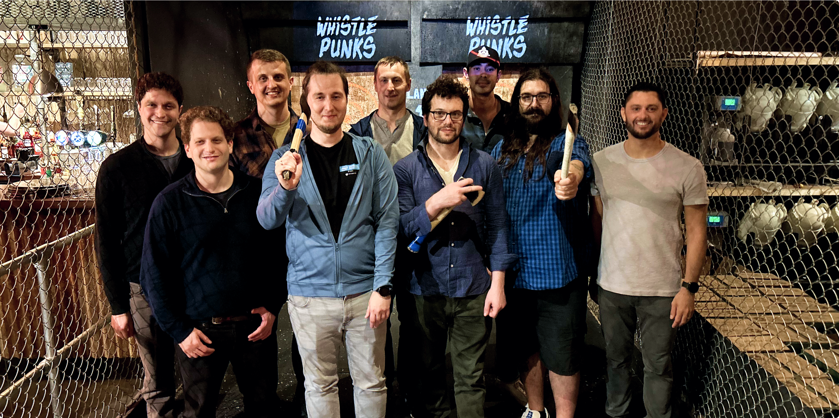 The Plural team standing together on a sidewalk in the French Quarter of New Orleans.